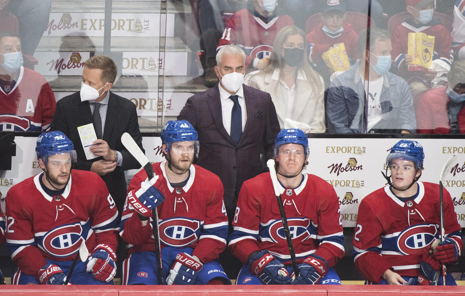 Montreal Canadiens coach Doninique Ducharme, center, watches from the bench during the first period of the team's NHL hockey game against the New York Rangers on Saturday, Oct. 16, 2021, in Montreal. (Graham Hughes/The Canadian Press via AP)