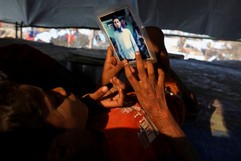 The Wider Image: 'Can't take this pain': Rohingya mother searches for son after refugee camp blaze