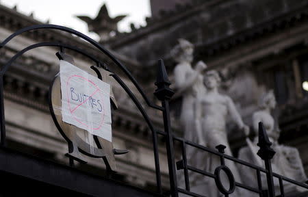 A "vultures forbidden" sign is seen placed over the main gate of the Congress during the Senate debate for the approval of a settlement with creditors over the country's defaulted debt, in Buenos Aires, Argentina, March 30, 2016. REUTERS/Marcos Brindicci