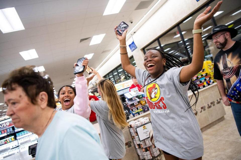 College student Sierra Gardener, right, jumps and cheers as she enters the new Buc-ee’s in Sevierville, Tenn., on its grand opening in June.