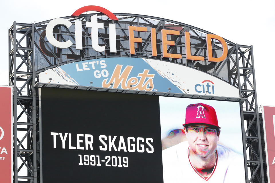 Los Angeles Angels' pitcher Tyler Skaggs is memorialized on a giant video screen during a moment of silence before an interleague baseball game between the New York Mets and the New York Yankees, Tuesday, July 2, 2019, in New York. (AP Photo/Kathy Willens)