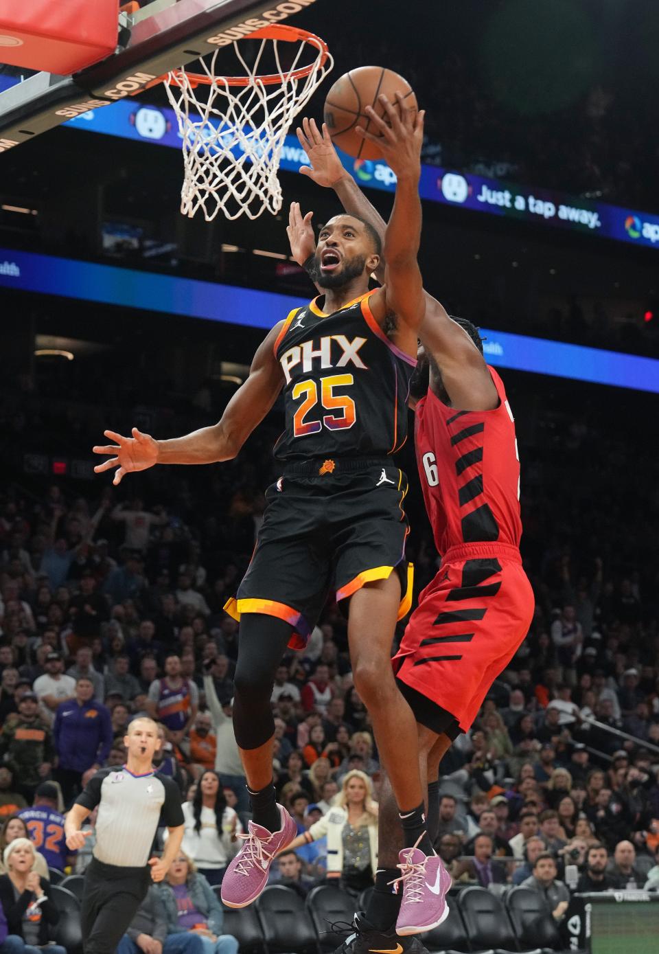 Nov 4, 2022; Phoenix, AZ, USA; Phoenix Suns forward Mikal Bridges (25) is fouled during a layup by Portland Trail Blazers guard Keon Johnson (9) at Footprint Center. Mandatory Credit: Joe Rondone-Arizona Republic