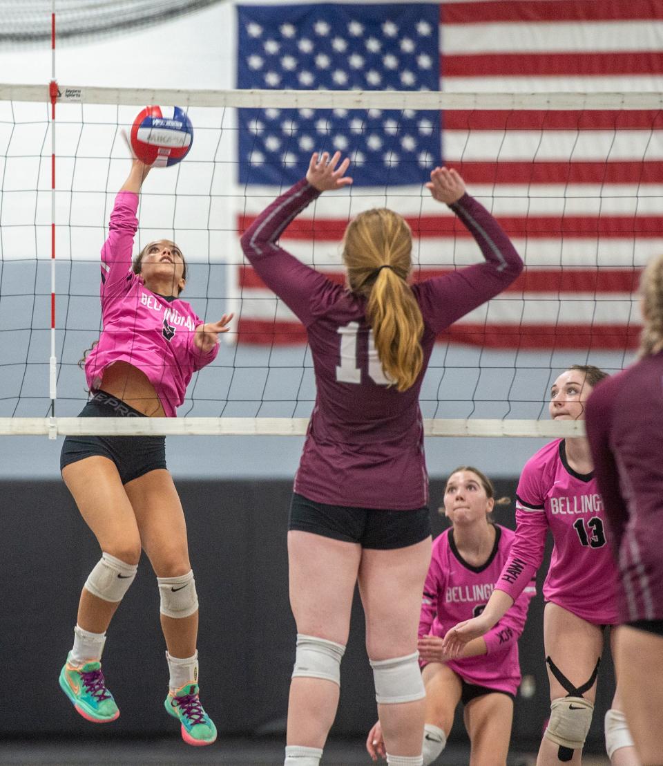 Bellingham High School's Mady DeOliveira with a spike against Dedham, Oct. 25, 2023.