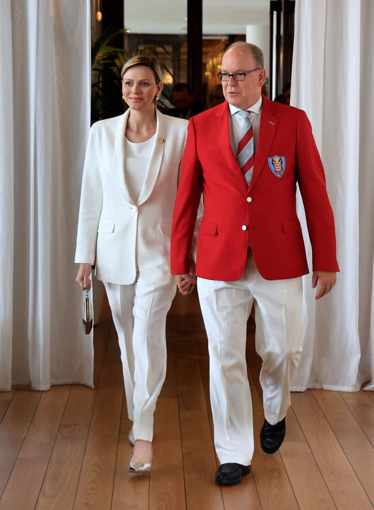 Prince Albert II of Monaco (R) and Princess Charlene of Monaco (L) arrive to the presentation of Monaco's Olympic team for the Paris 2024 Games, in Monaco on June 27, 2024. (Photo by Valery HACHE / AFP) (Photo by VALERY HACHE/AFP via Getty Images)