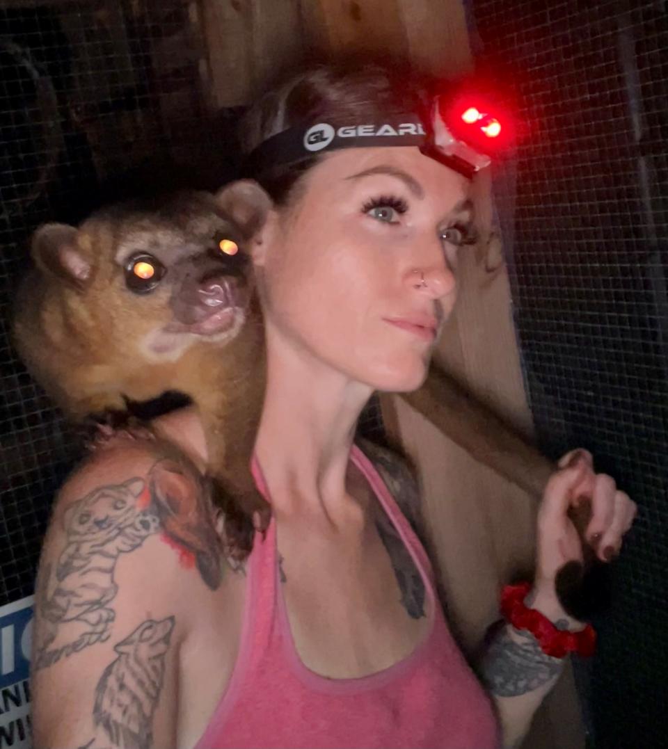 Alexandra on night duty with Binx the kinkajou (Collect/PA Real Life)