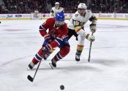 Nov 10, 2018; Montreal, Quebec, CAN; Montreal Canadiens forward Tomas Tatar (90) plays the puck and Vegas Golden Knights forward Alex Tuch (89) defends during the second period at the Bell Centre. Eric Bolte-USA TODAY Sports