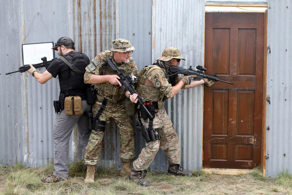 <p>Members of self-described patriot groups and militias run through close quarter combat shooting drills during III% United Patriots’ Field Training Exercise outside Fountain, Colo., July 29, 2017. (Photo: Jim Urquhart/Reuters) </p>