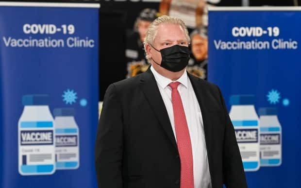 Ontario Premier Doug Ford attends a press conference after touring a mass COVID-19 vaccination site in Hamilton last month. (Nathan Denette/The Canadian Press - image credit)