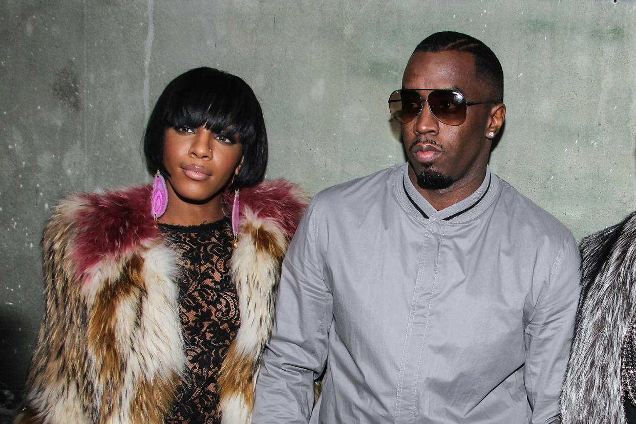 Dawn Richards and Diddy stand next to each other, against a concrete wall (Julien Hekimian / WireImage via Getty Images file)