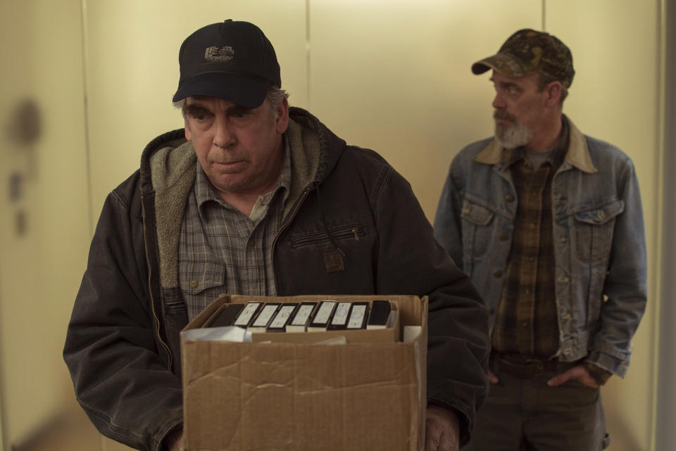 This image released by Focus Features shows Bill Camp, left, and Jim Azelvandre in a scene from "Dark Waters." (Mary Cybulski/Focus Features via AP)