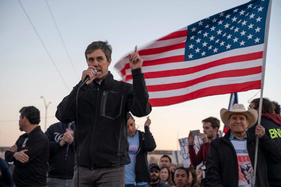 <p>Beto O'Rourke speaks to a crowd of marchers during the "March for Truth" in El Paso on Monday. The march took place at the same time as Trump's rally and culminated at a rally inside a baseball stadium. </p>