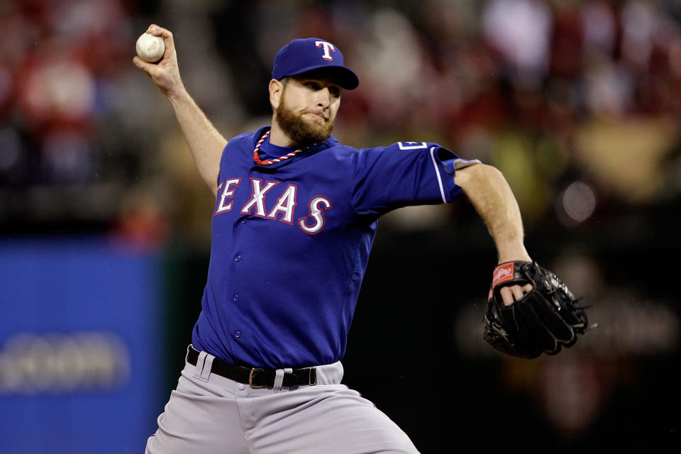 ST LOUIS, MO - OCTOBER 19: Scott Feldman #39 of the Texas Rangers pitches in the bottom of the seventh inning during Game One of the MLB World Series against the St. Louis Cardinals at Busch Stadium on October 19, 2011 in St Louis, Missouri. (Photo by Rob Carr/Getty Images)