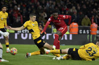 Liverpool's Divock Origi, center, scores the opening goal during the English Premier League soccer match between Wolverhampton Wanderers and Liverpool at the Molineux Stadium in Wolverhampton, England, Saturday, Dec. 4, 2021. (AP Photo/Rui Vieira)