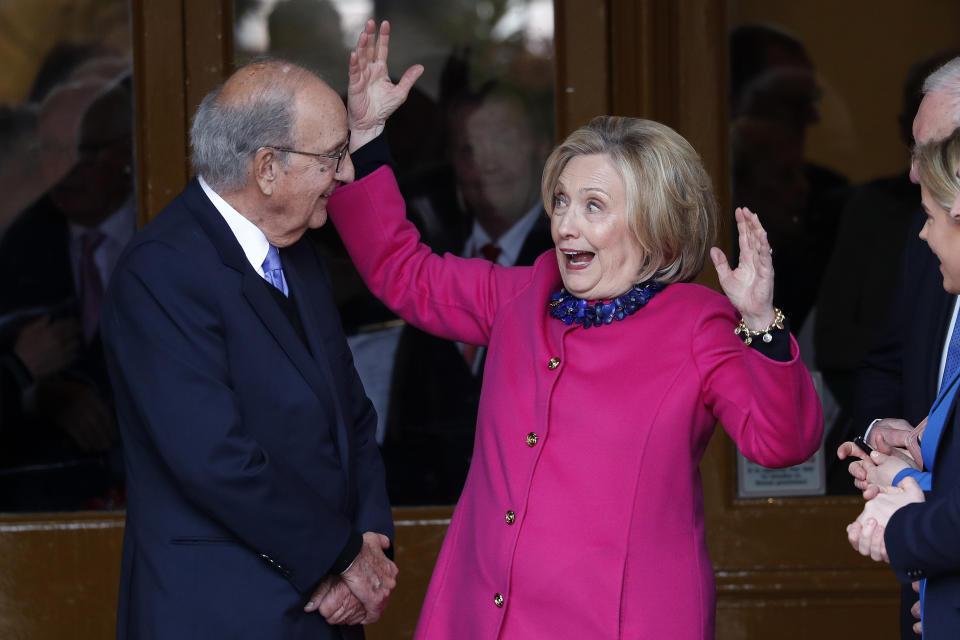 Former U.S. Sen. George Mitchell, left, and former US Secretary of State Hillary Clinton chat on the first day of a three-day international conference at Queen's University Belfast to mark the 25th anniversary of the Good Friday Agreement, in Belfast, Northern Ireland, Monday, April 17, 2023. Former U.S. President Bill Clinton and past leaders of the U.K. and Ireland are gathering in Belfast on Monday, 25 years after their charm, clout and determination helped Northern Ireland strike a historic peace accord. (AP Photo/Peter Morrison)