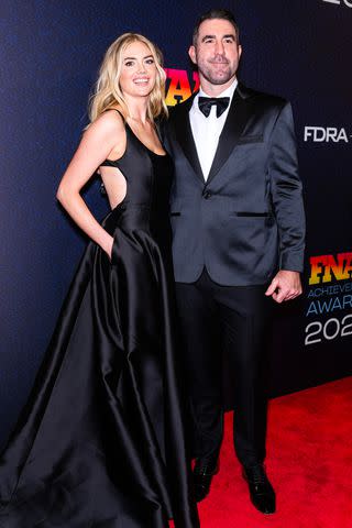 <p>Gotham/WireImage</p> Kate Upton and Justin Verlander pose together at the 37th annual Footwear News Achievement Awards in NYC