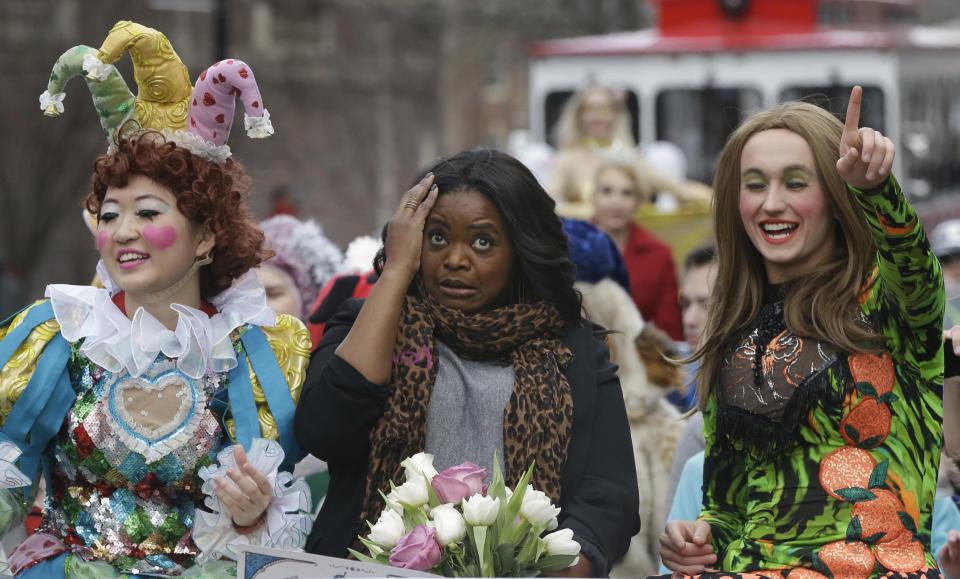 Guan-Yue Chen, Hasty Pudding Theatricals President, left, and Dan Milashewski, vice president, right, ride with actress Octavia Spencer during a parade to honor Spencer as the Hasty Pudding Theatricals Woman of the Year Thursday, Jan. 26, 2017, in Cambridge, Mass. (AP Photo/Stephan Savoia)