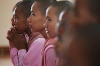 Buddhist nuns pray during the annual meeting of the nationalist group Buddha Dhamma Parahita Foundation, previously known as Ma Ba Tha in Yangon,