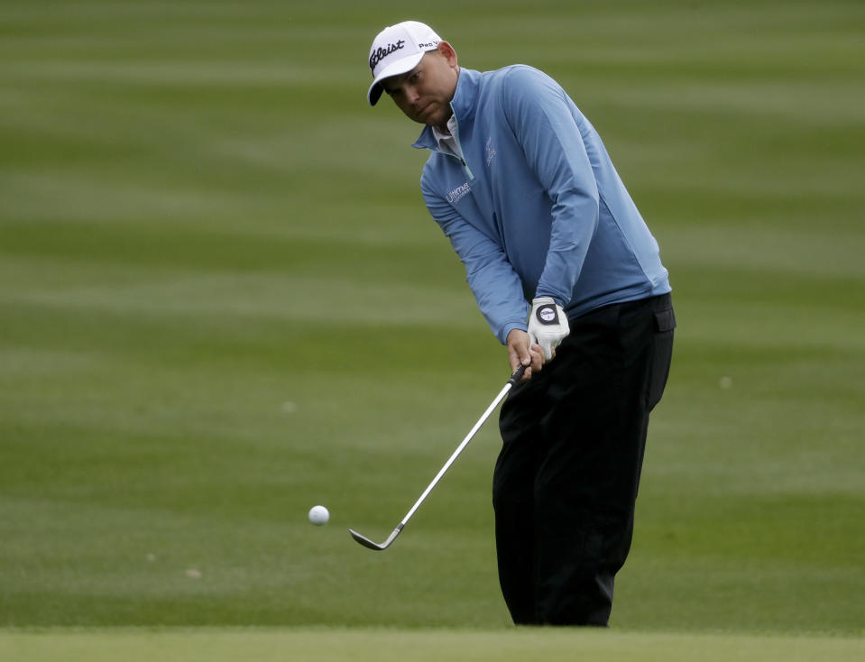 Bill Haas chips the the second hole during the first round of the CareerBuilder Challenge at the La Quinta Country Club, Thursday, Jan. 19, 2017 in La Quinta, Calif. (AP Photo/Chris Carlson)