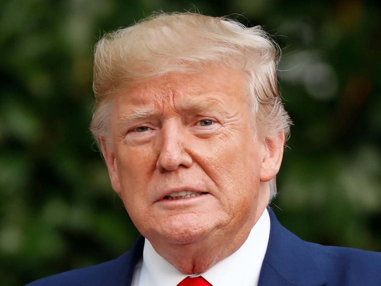 Donald Trump looks towards members of the media on the South Lawn of the White House: AP