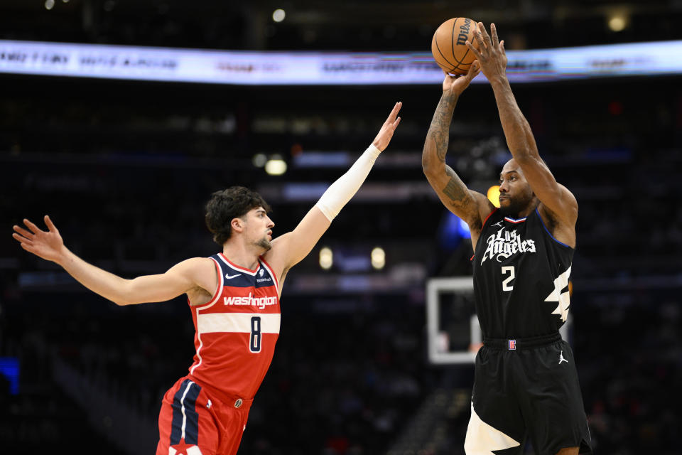 Los Angeles Clippers forward Kawhi Leonard (2) shoots against Washington Wizards forward Deni Avdija (8) during the first half of an NBA basketball game, Wednesday, Jan. 31, 2024, in Washington. (AP Photo/Nick Wass)