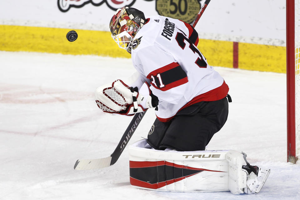 Ottawa Senators goalie Anton Forsberg makes a save against the Calgary Flames during the first period of an NHL hockey game Sunday, May 9, 2021, in Calgary, Alberta. (Larry MacDougal/The Canadian Press via AP)