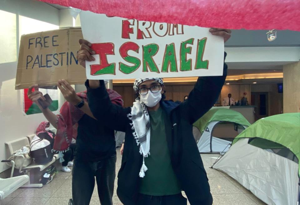 Student protesters turned up with signs calling for the university to divest from Israel. James Messerschmidt