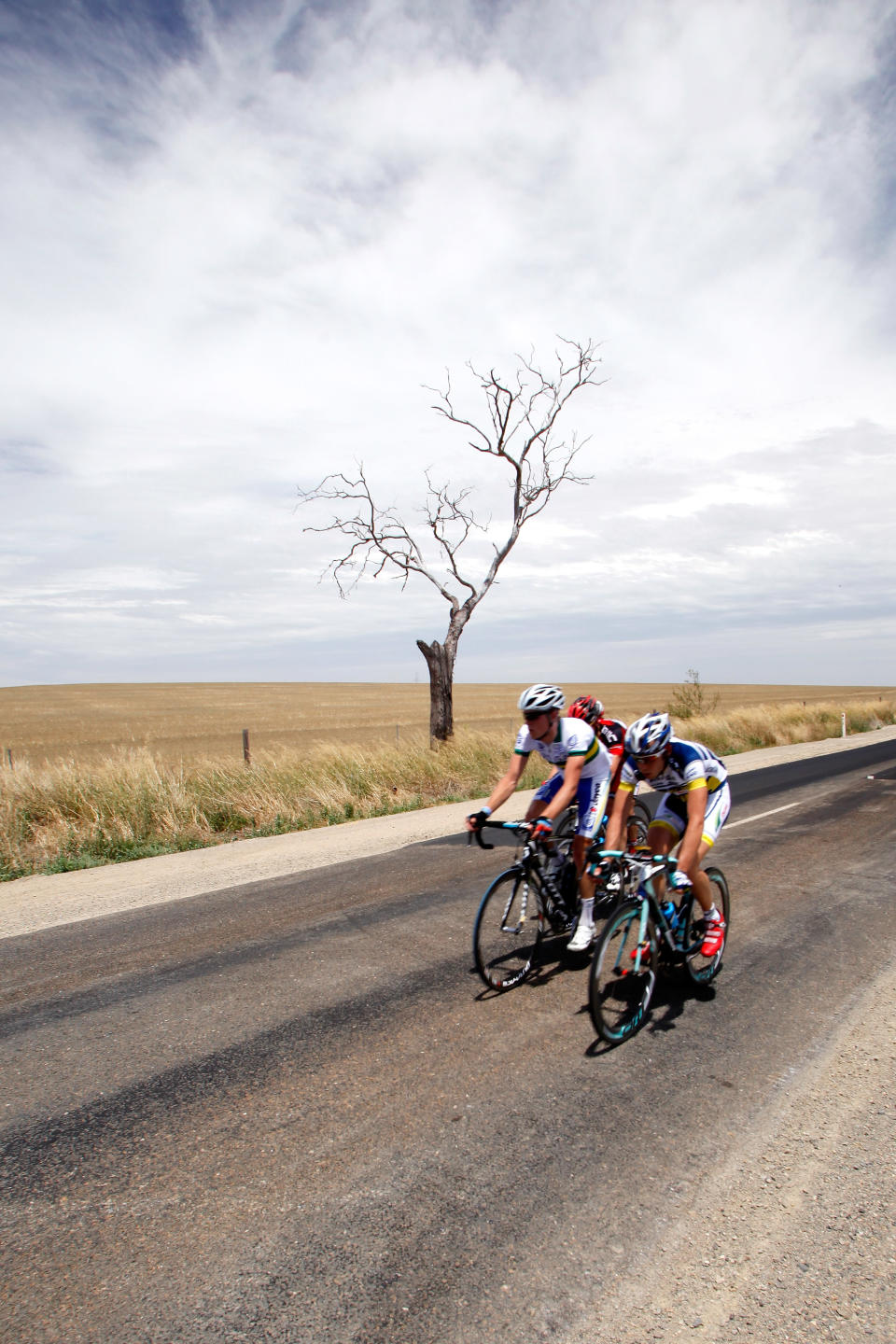 ADELAIDE, AUSTRALIA - JANUARY 17: (EDITORS NOTE: A polarizng filter was used for this image.) A breakaway group of 4 riders includes Rohan Dennis (L) of Australia and the Uni SA-Australia team and Marcello Pavarin (R) of Italy and the Vacansoleil-DMC team during stage one of the 2012 Tour Down Under on January 17, 2012 in Adelaide, Australia. (Photo by Morne de Klerk/Getty Images)