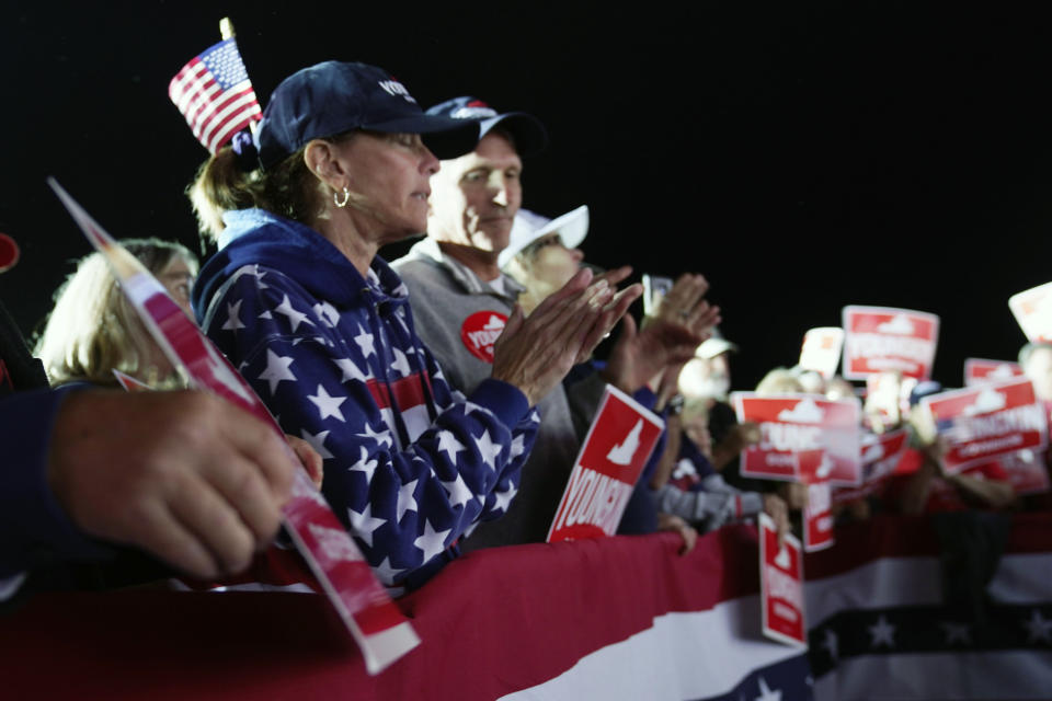 Supporters of Republican gubernatorial candidate Glenn Youngkin cheer their candidate during a rally in Glen Allen, Va., Saturday, Oct. 23, 2021. Youngkin will face Democrat Terry McAuliffe in the November election. (AP Photo/Steve Helber)