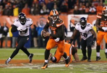 Cleveland Browns quarterback Austin Davis (7) scrambles in the second half against the Baltimore Ravens at FirstEnergy Stadium. The Ravens won 33-27. Mandatory Credit: Aaron Doster-USA TODAY Sports