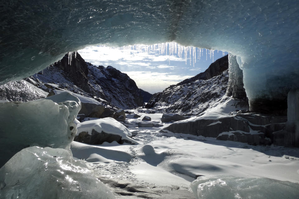 Ice coats a cave in the Eagle Glacier on Sunday, Feb. 14, 2021, in Juneau, Alaska. The glacier is remote, and one way to access it involves a 5.5 mile hike on a rugged trail to a public use cabin followed by lake crossings. (AP Photo/Becky Bohrer)