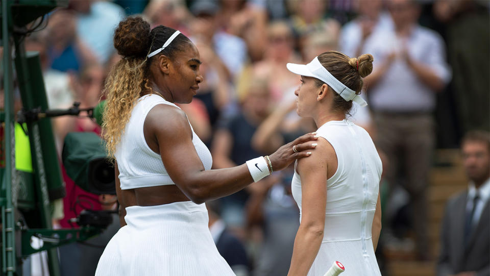 Simona Halep and Serena Williams meet at the net after the Wimbledon final. (Photo by Visionhaus/Getty Images)