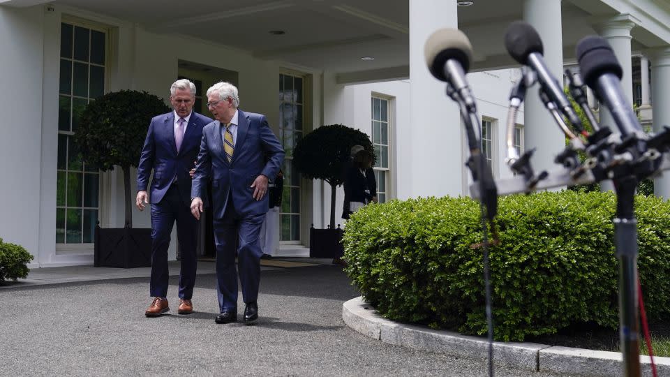 Senate Minority Leader Mitch McConnell and then-House Minority Leader Kevin McCarthy walk outside the White House after a meeting with President Joe Biden on May 12, 2021. - Evan Vucci/AP