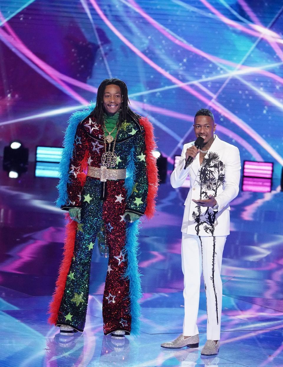 (L-R) Wiz Khalifa and host Nick Cannon in "The Masked Singer" finale.