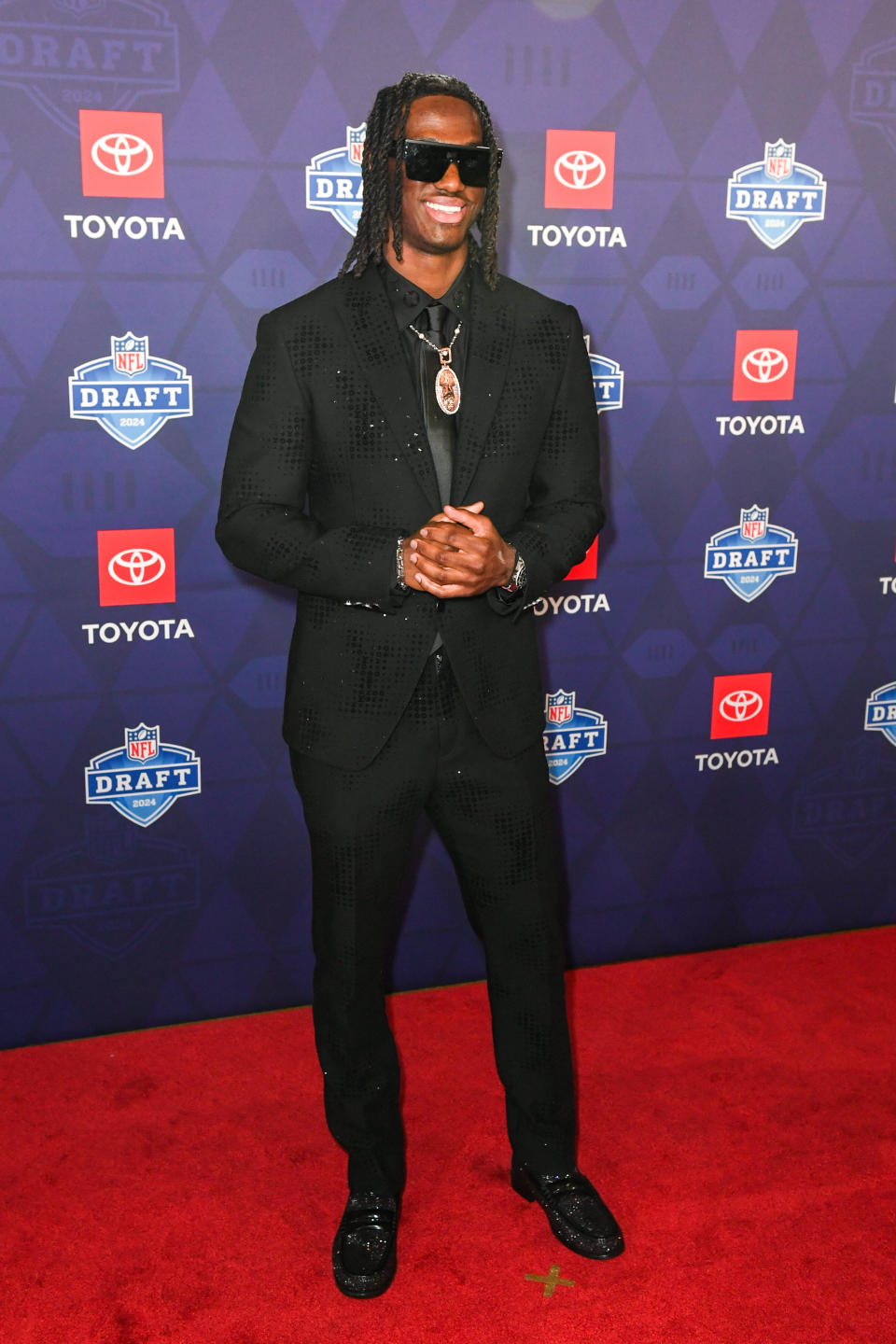 best dressed, louis vuitton suit,  DETROIT, MICHIGAN - APRIL 25: Marvin Harrison Jr. arrives to the 2024 NFL Draft at the Fox Theatre on April 25, 2024 in Detroit, Michigan. (Photo by Aaron J. Thornton/Getty Images)