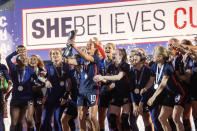 United States captain Carli Lloyd hoists the SheBelieves Cup trophy after a SheBelieves Cup women's soccer match against Japan, Wednesday, March 11, 2020 at Toyota Stadium in Frisco, Texas. (AP Photo/Jeffrey McWhorter)