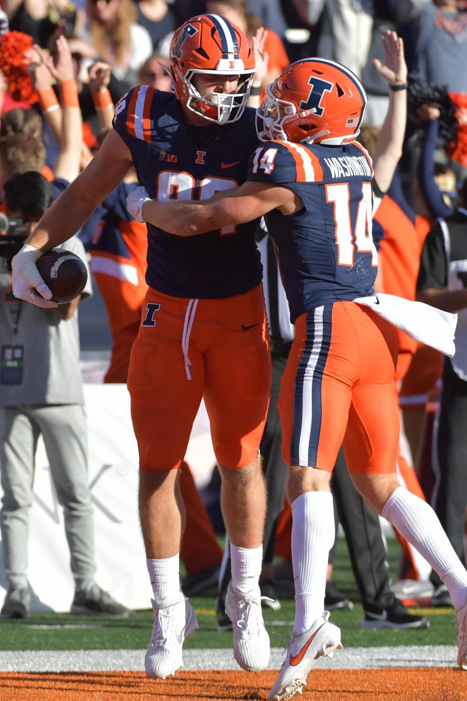 Oct 21, 2023; Champaign, Illinois, USA; Illinois Fighting Illini tight end Tip Reiman (89) celebrates with wide receiver Casey Washington (14) after scoring a touchdown during the first half at Memorial Stadium. Mandatory Credit: Ron Johnson-USA TODAY Sports