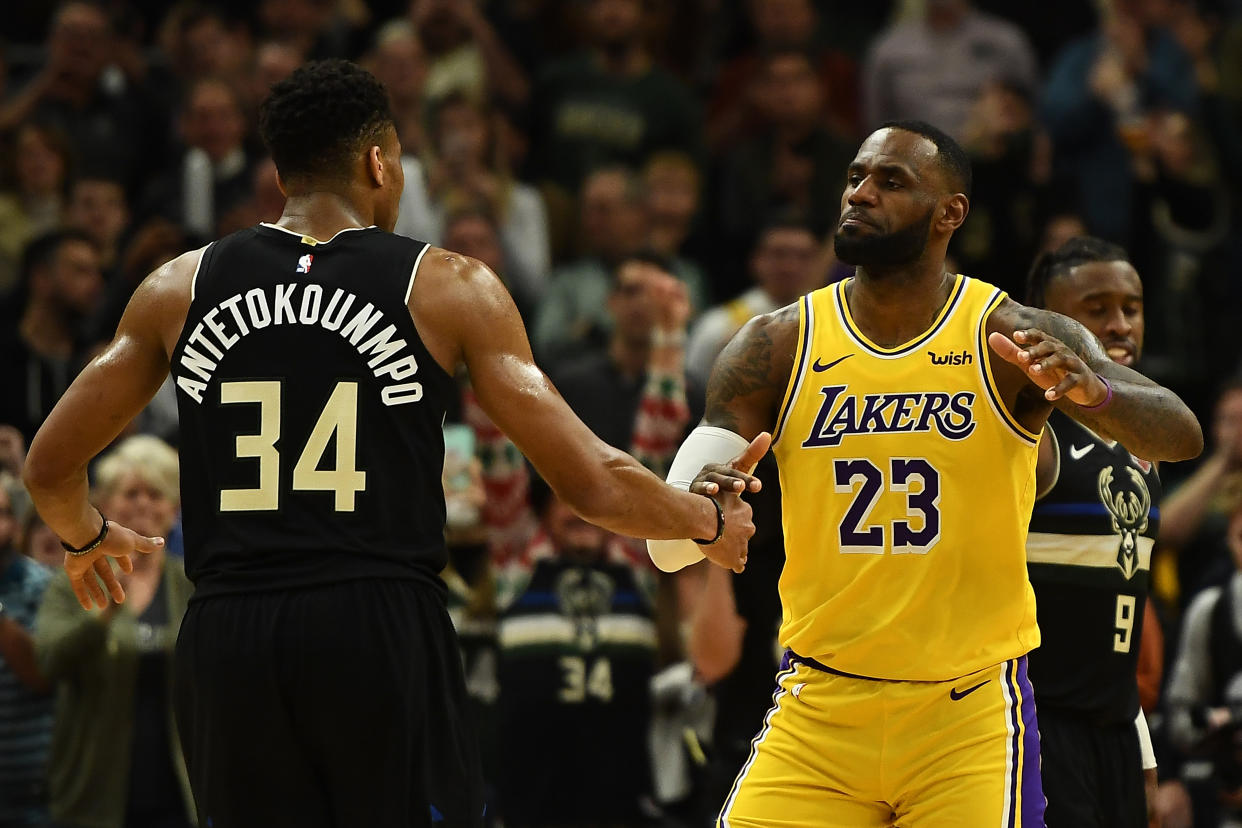 Giannis Antetokounmpo and LeBron James pay their respects during their meeting earlier in the season. (Stacy Revere/Getty Images)