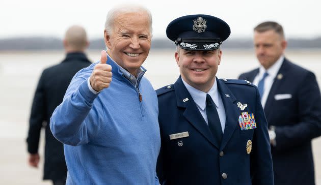 This is NOT a photo of Joe Biden legalizing cannabis, because he's never done that. Rather, he's posing for a photo with Air Force Colonel Paul Pawluk at Joint Base Andrews in Maryland, on Jan. 25.