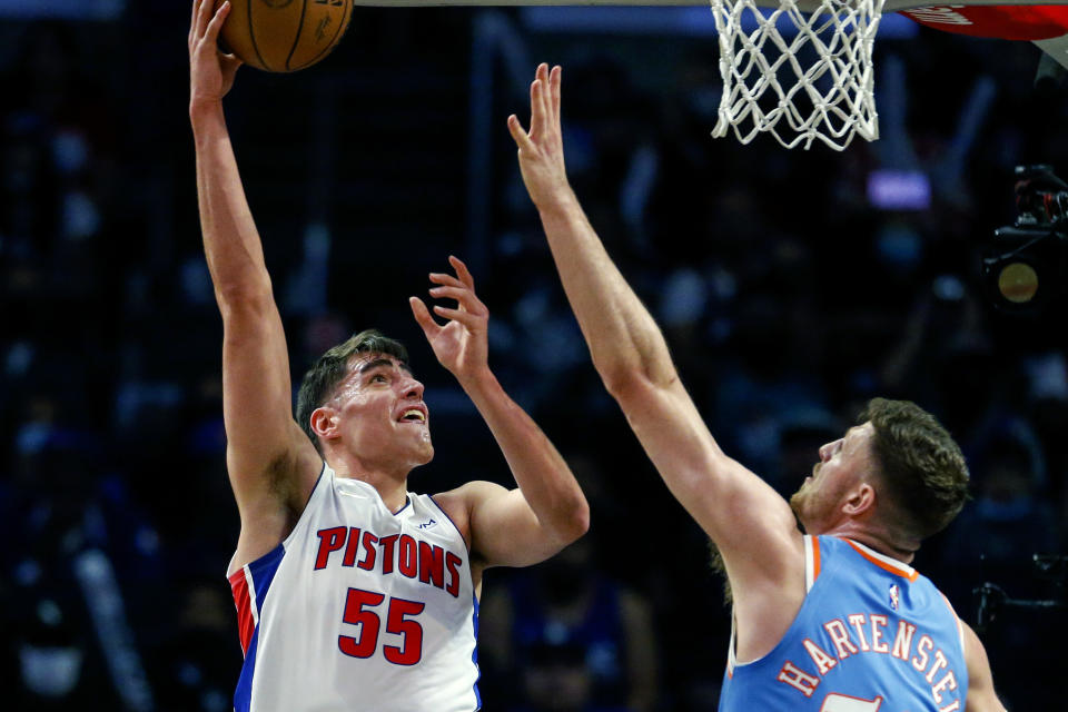 Detroit Pistons center Luka Garza (55) shoots against Los Angeles Clippers center Isaiah Hartenstein (55) during the second half of an NBA basketball game Friday, Nov. 26, 2021, in Los Angeles. The Clippers won 107-96. (AP Photo/Ringo H.W. Chiu)