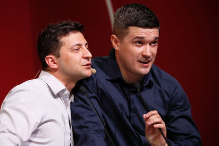 Ukraine's President Volodymyr Zelenskiy (L) and his adviser Michael Fedorov attend an IT conference in Kiev, Ukraine May 23, 2019. REUTERS/Valentyn Ogirenko