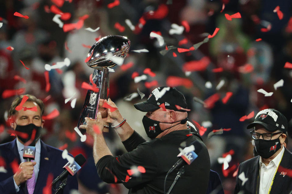 TAMPA, FLORIDA - FEBRUARY 07: Head coach Bruce Arians of the Tampa Bay Buccaneers lifts the Lombardi Trophy after defeating the Kansas City Chiefs in Super Bowl LV at Raymond James Stadium on February 07, 2021 in Tampa, Florida. The Buccaneers defeated the Chiefs 31-9. (Photo by Patrick Smith/Getty Images)