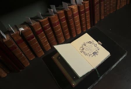 A copy of "The Tales of Beedle the Bard", handwritten and illustrated by Harry Potter author JK Rowling, is displayed at Sotheby's auction house in London, Britain December 8, 2016. REUTERS/Eddie Keogh