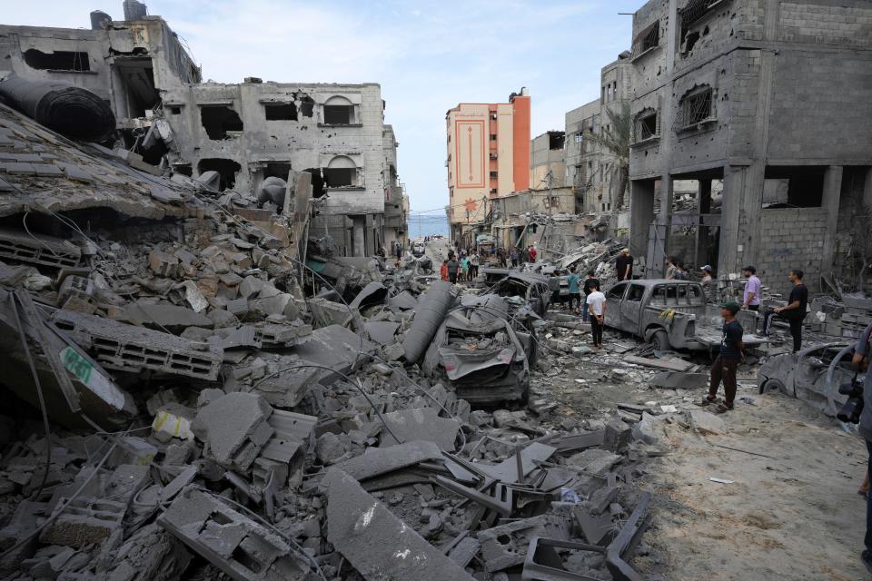 Palestinians inspect the rubble of the West mosque destroyed after it was hit by an Israeli airstrike Monday at Shati refugee camp in Gaza City. (AP Photo/Adel Hana)