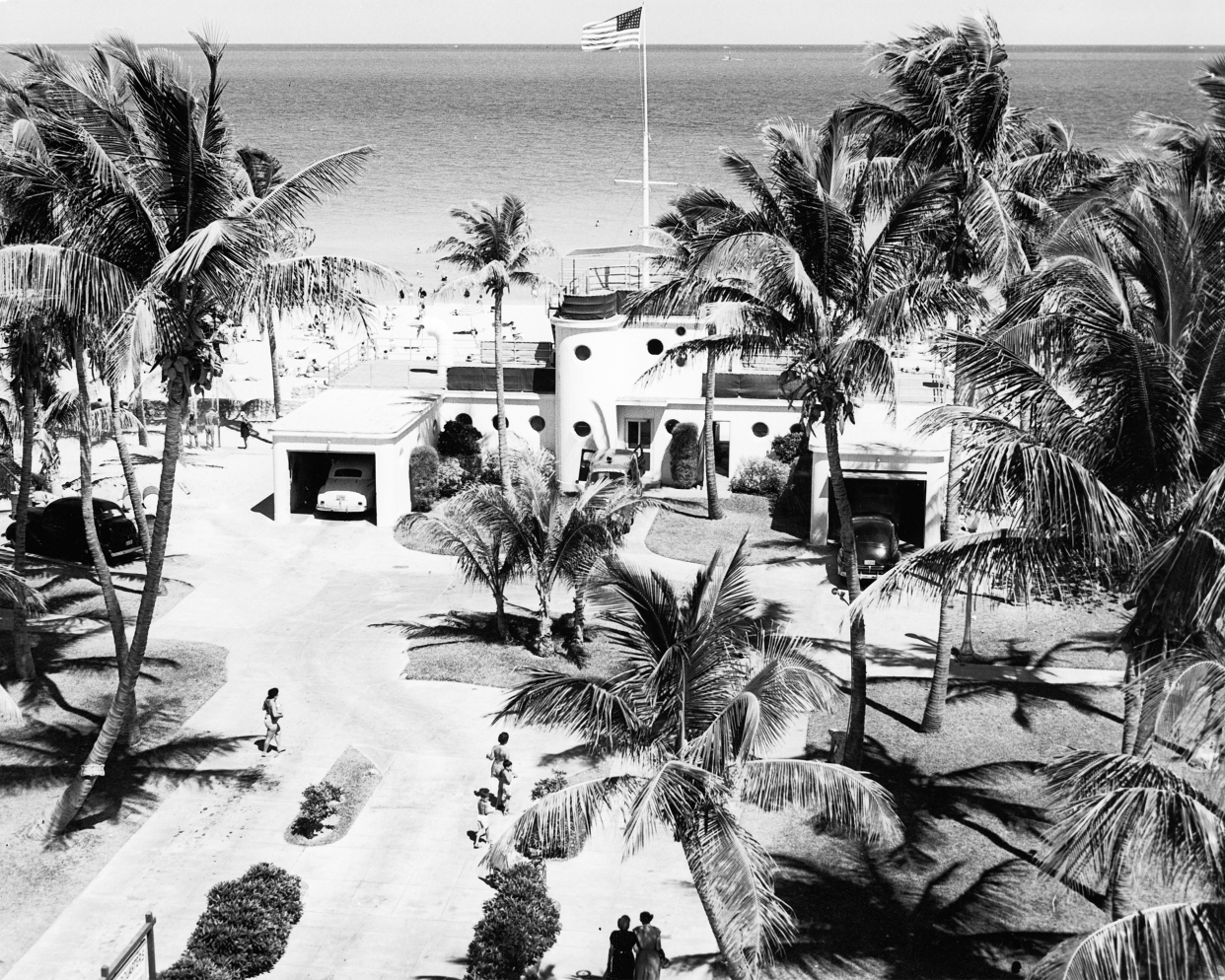 An Art Deco parks department building stands next to a public beach, Miami Beach, Florida, late 1940s.