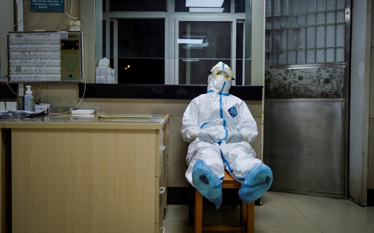 A health worker in Wuhan takes a break - Reuters/China Daily 