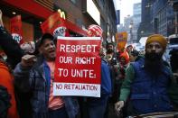 Fast food workers attend a protest against McDonald's outside one of its restaurants in New York, December 5, 2013. (REUTERS/Eduardo Munoz)