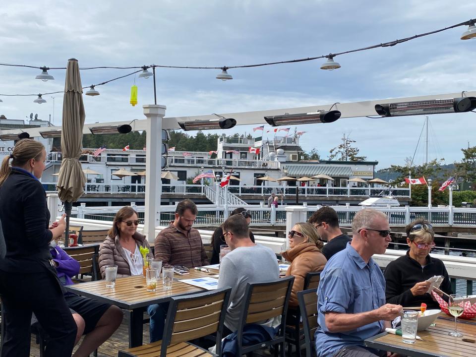 The San Juan Islands near Seattle, Wash., enjoy a temperate year-round climate, allowing for leisurely outdoor dining and recreational activities for many months of the year. Guests at Madrona Bar and Grill at Roche Harbor Resort on San Juan Island overlook the marina and marketplace.