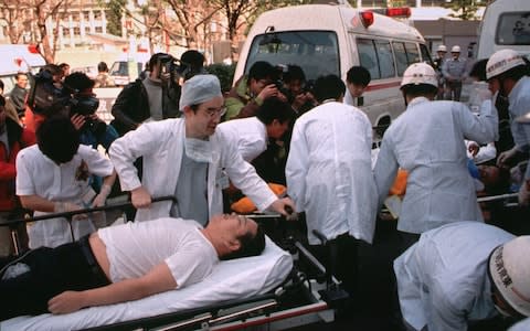 Subway passengers affected by sarin nerve gas in the Tokyo subway are taken to hospital March 20, 1995 - Credit: Chiaki Tsukumo/AP