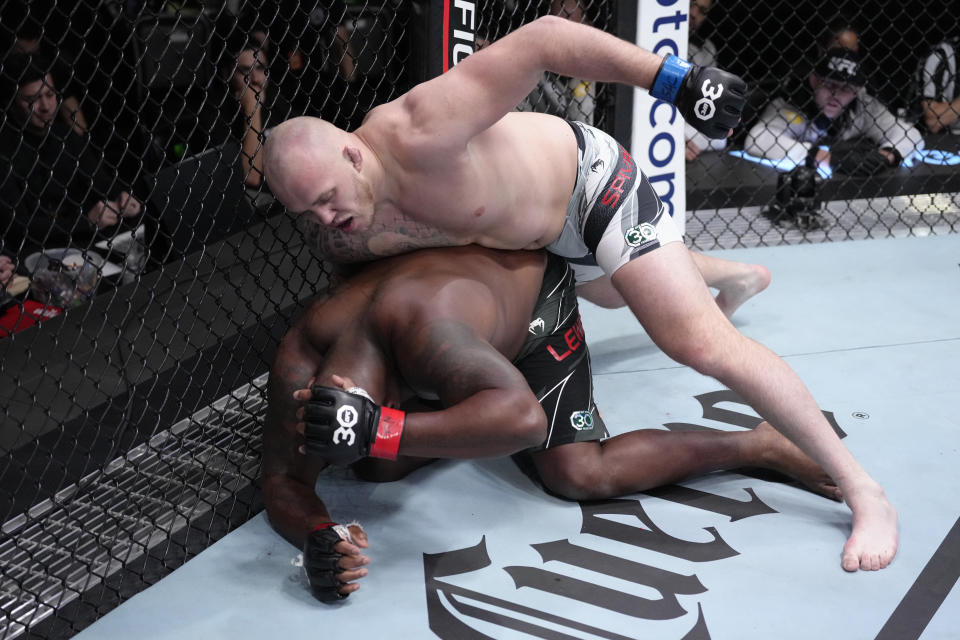 LAS VEGAS, NEVADA – FEBRUARY 04: (R-L) Serghei Spivac of Moldova punches Derrick Lewis in a heavyweight fight during the UFC Fight Night event at UFC APEX on February 04, 2023 in Las Vegas, Nevada. (Photo by Jeff Bottari/Zuffa LLC via Getty Images)