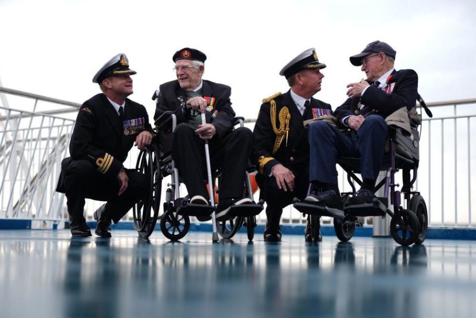 Royal Navy Commander Glen Hinson, D-Day veteran Jim Grant, Royal Navy Commodore John Boyce, and D-Day veteran Charles Horne, on board the Brittany Ferries ship Mont St Michel